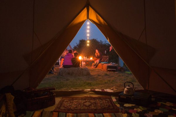 Inside a bell tent looking out